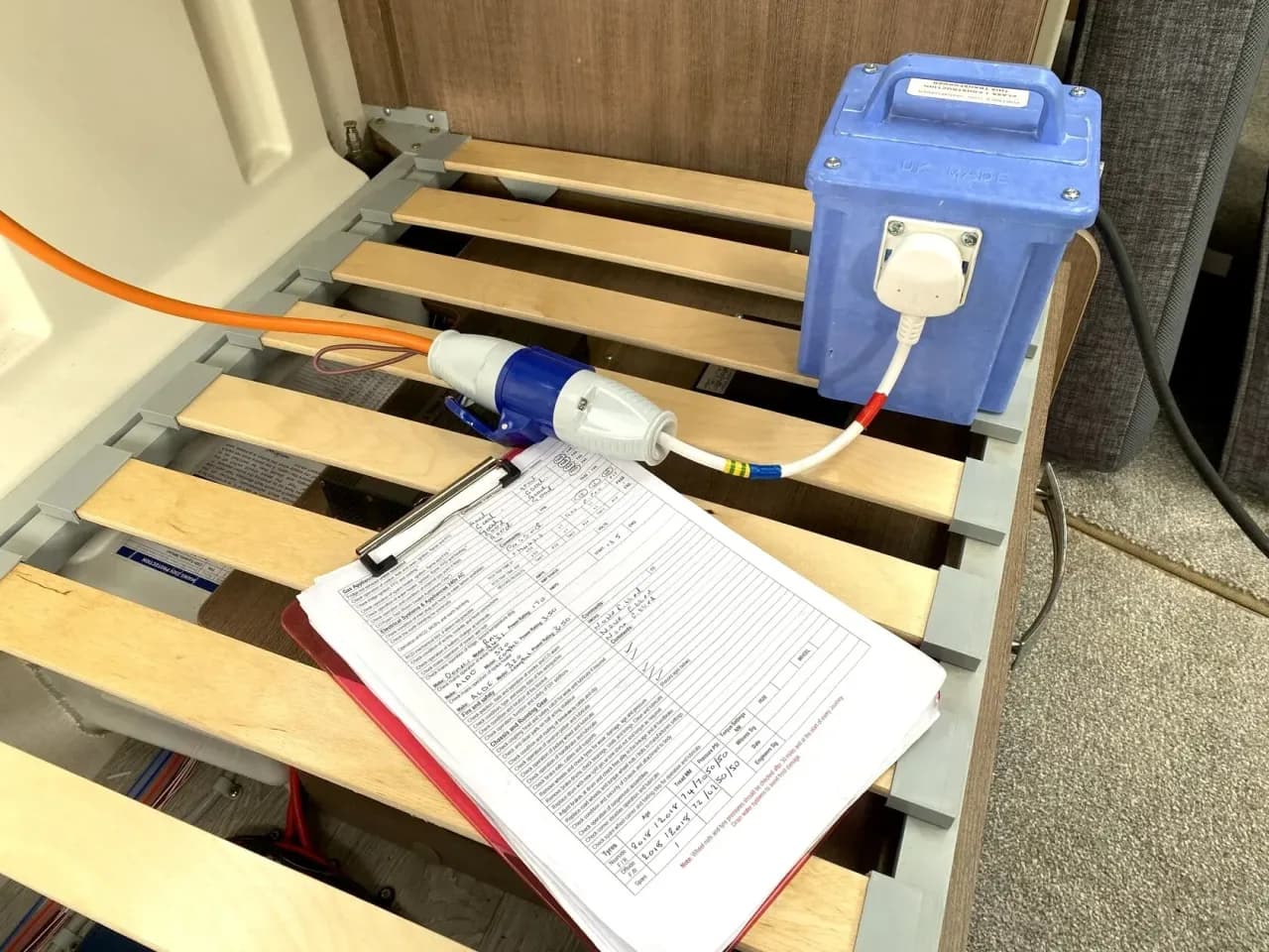 Caravan 230V electrical system safety inspection with portable isolating transformer and service checklist